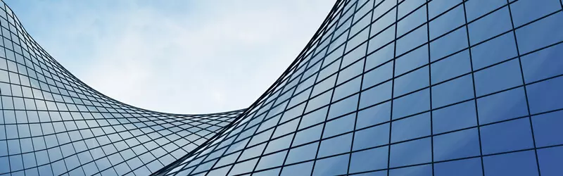 Clouds reflected in a glass office building