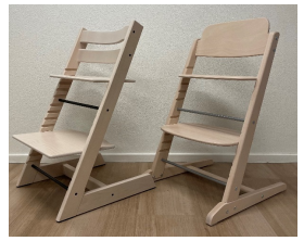 A pair of wooden chairs
AI-generated content may be incorrect.