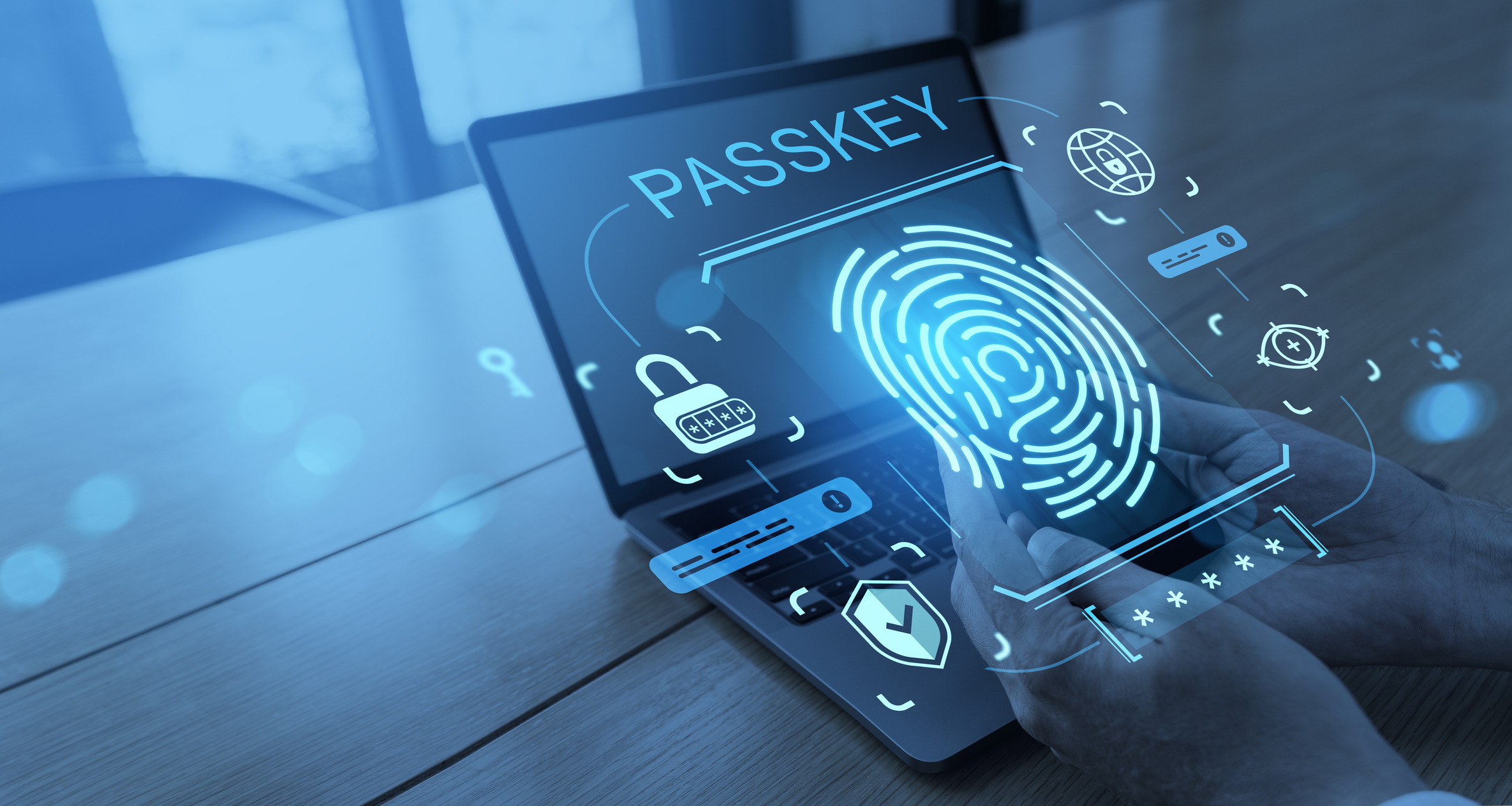 Smartphone with fingerprint scanner and digital passkey authentication icons over laptop, in a modern office, symbolizing biometric security verification