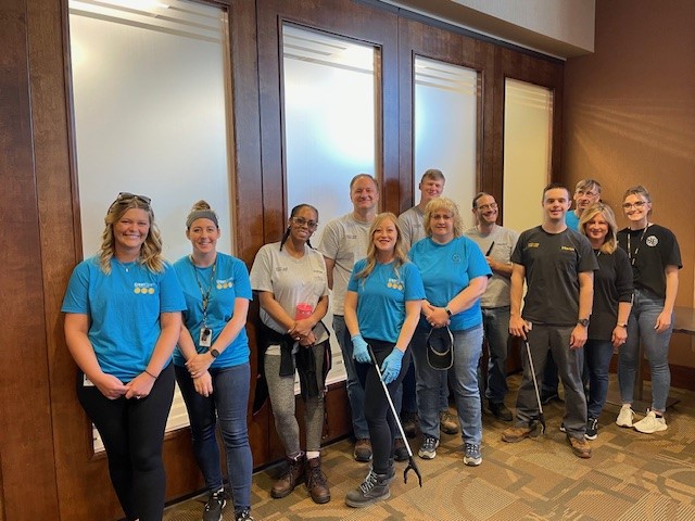 A group of people posing for a photo

Description automatically generated