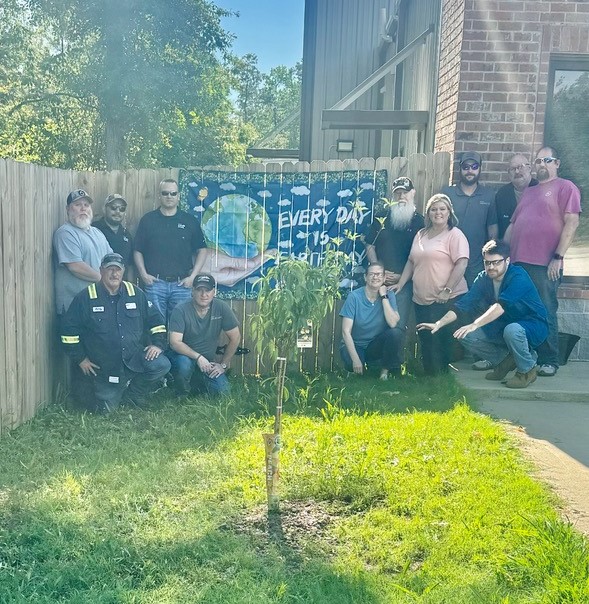 A group of people posing for a photo

Description automatically generated