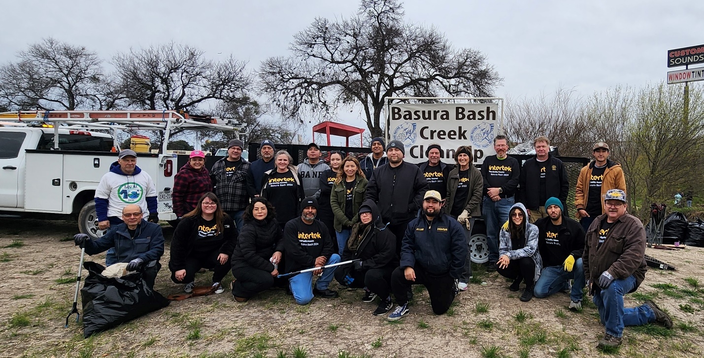 A group of people posing for a photo

Description automatically generated