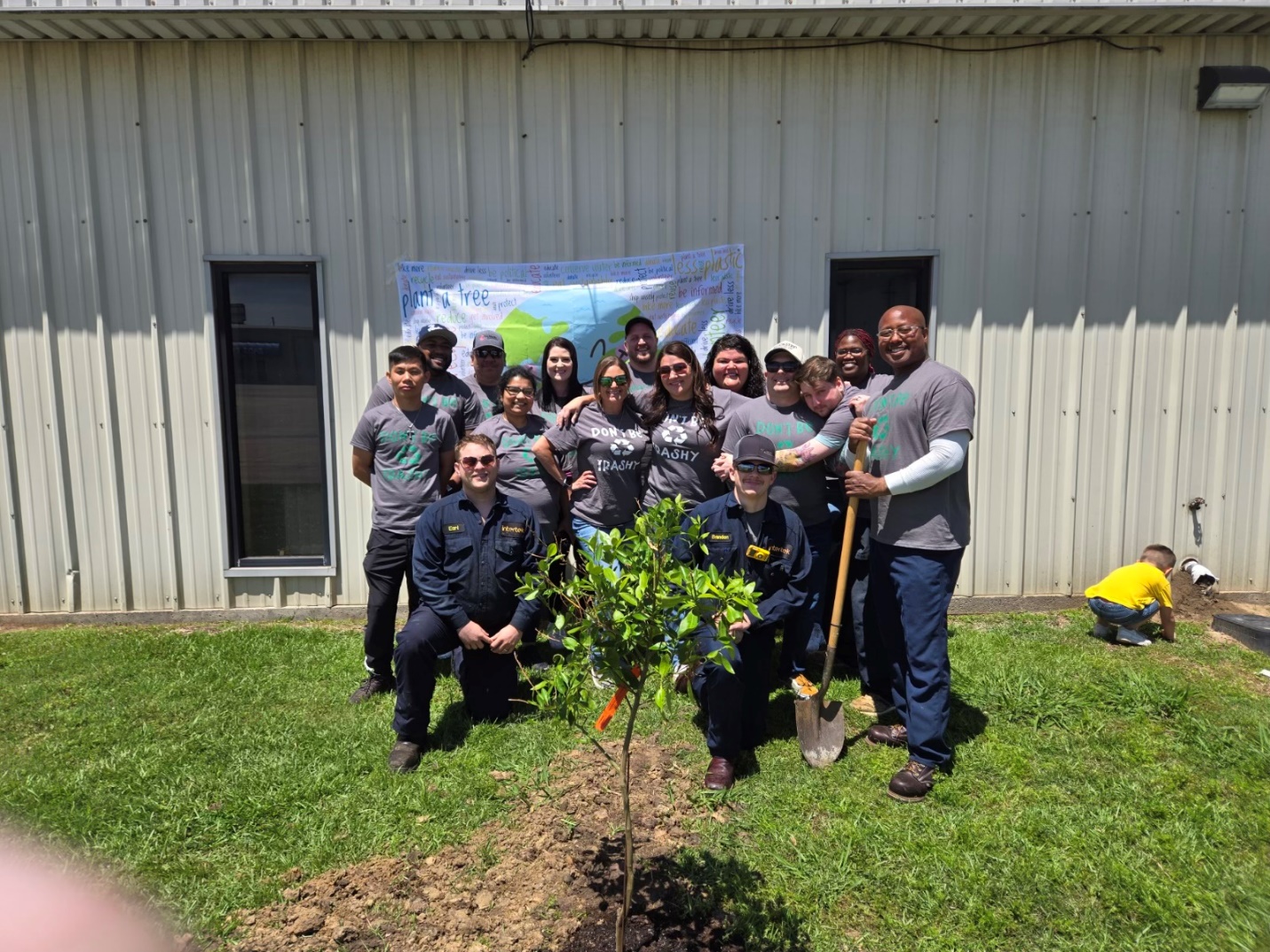 A group of people posing for a photo

Description automatically generated
