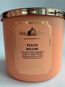 A jar of peach colored liquid

Description automatically generated